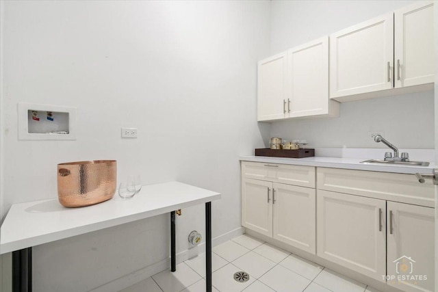 3800 N Christiana Ave, Chicago, IL 60618 - washroom featuring cabinet space, washer hookup, and light tile patterned flooring