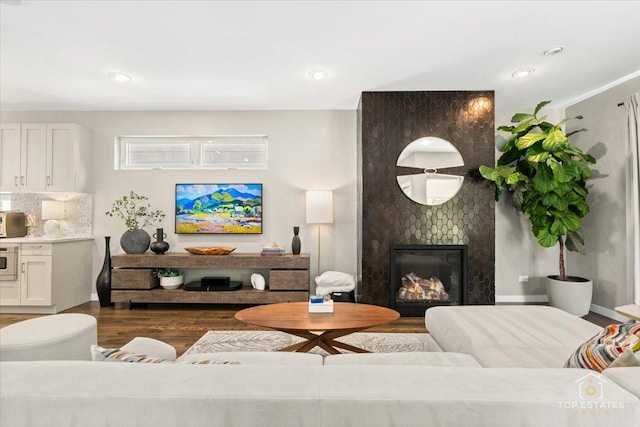 3800 N Christiana Ave, Chicago, IL 60618 - living room with dark wood finished floors, a fireplace, and recessed lighting
