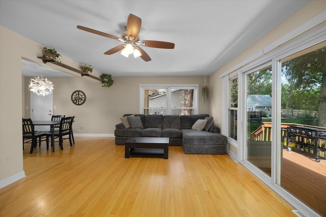 4606 Willow Ln, Mchenry, IL 60050 - living room featuring a chandelier, light wood-style flooring, and a ceiling fan