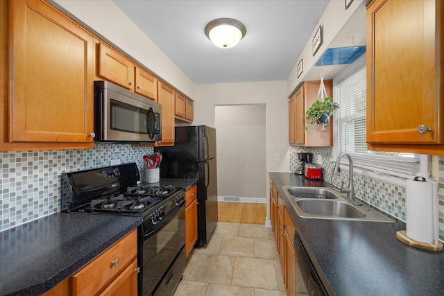 4606 Willow Ln, Mchenry, IL 60050 - kitchen featuring black appliances, decorative backsplash, dark countertops, and brown cabinets