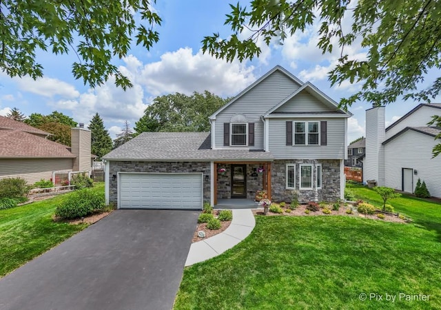 987 Split Rail Dr, Carol Stream, IL 60188 - traditional home with driveway, a garage, stone siding, and a front lawn