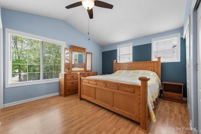 987 Split Rail Dr, Carol Stream, IL 60188 - bedroom featuring lofted ceiling, light wood-style flooring, and a ceiling fan