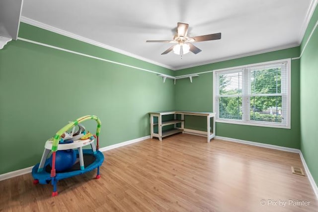 987 Split Rail Dr, Carol Stream, IL 60188 - game room featuring crown molding, ceiling fan, and wood finished floors