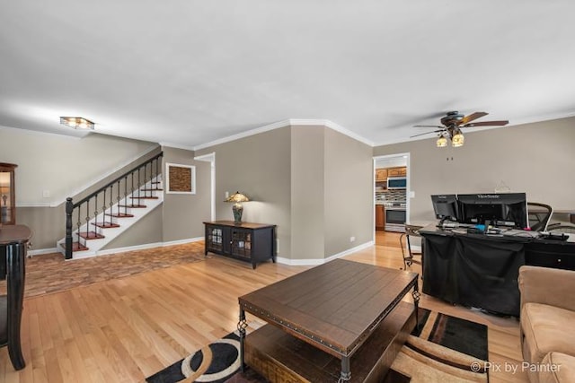 987 Split Rail Dr, Carol Stream, IL 60188 - living area with stairway, light wood-style floors, a ceiling fan, ornamental molding, and an office area