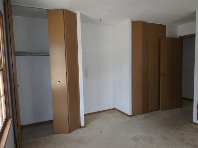 1412 11th Ave, Sterling, IL 61081 - unfurnished bedroom with a closet and light colored carpet