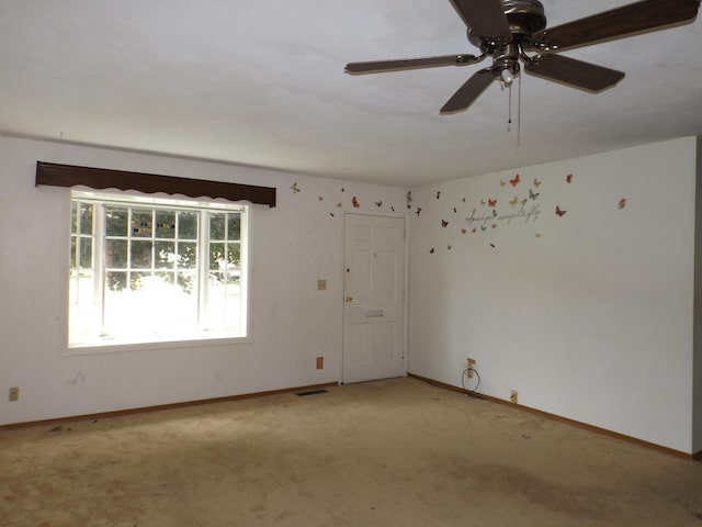 1412 11th Ave, Sterling, IL 61081 - carpeted spare room featuring a ceiling fan and baseboards