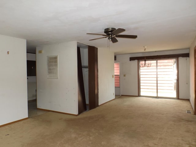 1412 11th Ave, Sterling, IL 61081 - carpeted spare room featuring ceiling fan and a chandelier