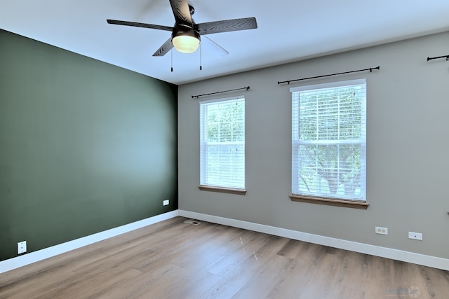 2141 Bluemist Dr, Aurora, IL 60504 - empty room with a ceiling fan and wood finished floors