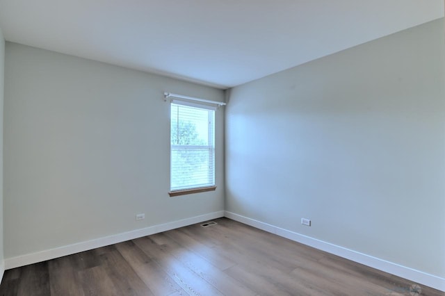2141 Bluemist Dr, Aurora, IL 60504 - spare room featuring baseboards and dark wood finished floors