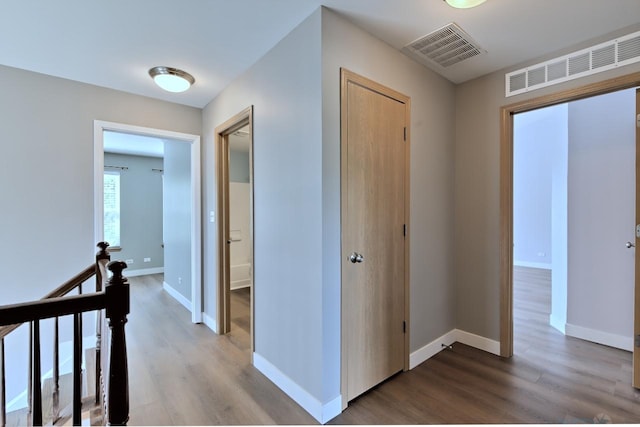 2141 Bluemist Dr, Aurora, IL 60504 - hall featuring an upstairs landing and wood finished floors