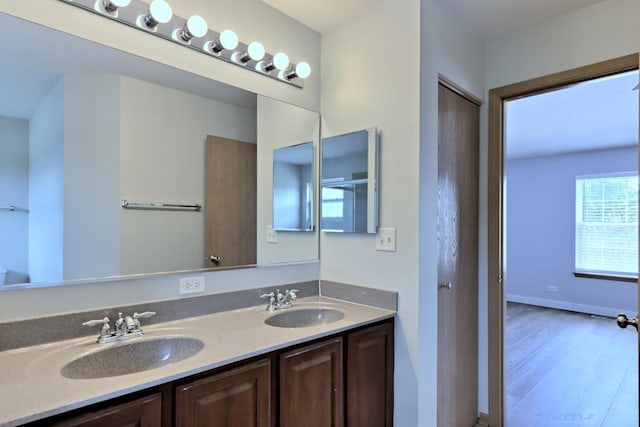 2141 Bluemist Dr, Aurora, IL 60504 - full bathroom featuring double vanity and wood finished floors
