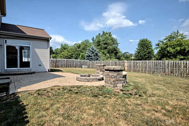 2141 Bluemist Dr, Aurora, IL 60504 - fenced backyard featuring a fire pit and a patio area