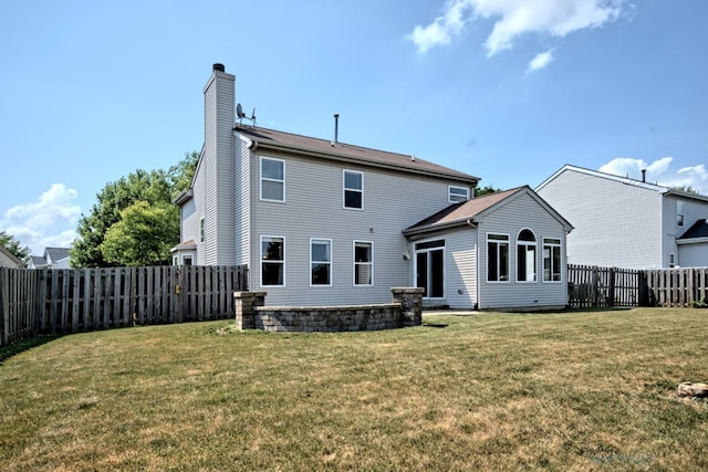 2141 Bluemist Dr, Aurora, IL 60504 - back of house with a chimney and a fenced backyard