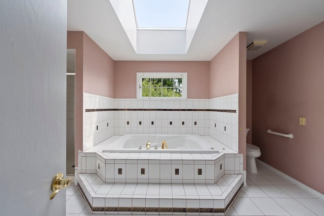 201 E White Oak St, Arlington Heights, IL 60005 - bathroom featuring tile patterned floors, a bath, and a skylight
