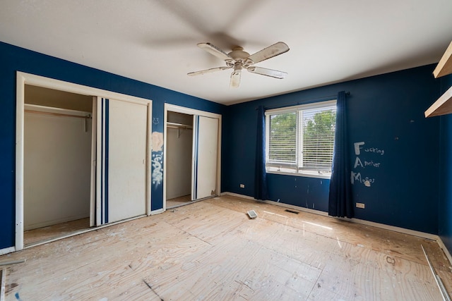 201 E White Oak St, Arlington Heights, IL 60005 - unfurnished bedroom with multiple closets and ceiling fan
