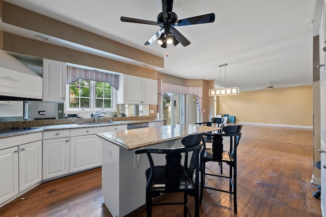 201 E White Oak St, Arlington Heights, IL 60005 - kitchen featuring white cabinets, dark wood-style flooring, black electric cooktop, and ceiling fan