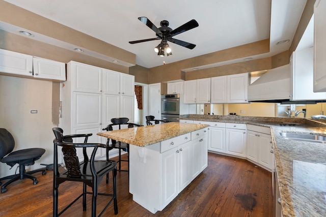 201 E White Oak St, Arlington Heights, IL 60005 - kitchen with ceiling fan, white cabinetry, and double oven