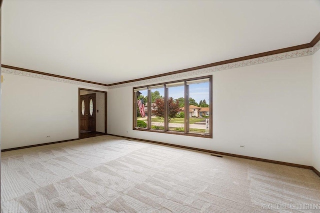 1054 Maple Ln, Batavia, IL 60510 - empty room featuring light colored carpet and crown molding