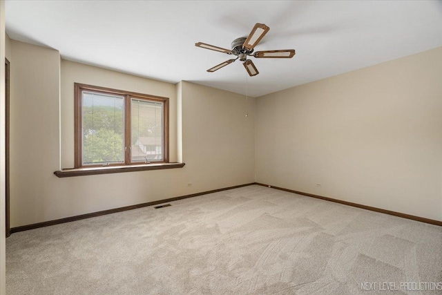 1054 Maple Ln, Batavia, IL 60510 - carpeted spare room featuring a ceiling fan and baseboards
