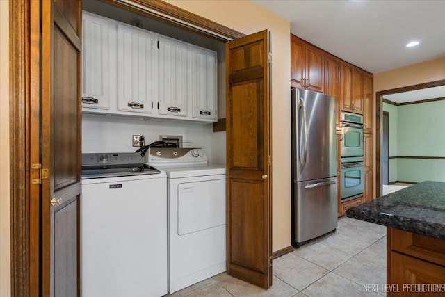 1054 Maple Ln, Batavia, IL 60510 - laundry room with washer and dryer, light tile patterned floors, and recessed lighting