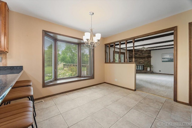 1054 Maple Ln, Batavia, IL 60510 - unfurnished dining area featuring a chandelier, light tile patterned floors, and beamed ceiling