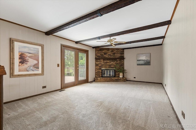 1054 Maple Ln, Batavia, IL 60510 - unfurnished living room featuring beam ceiling, ceiling fan, french doors, carpet, and a fireplace