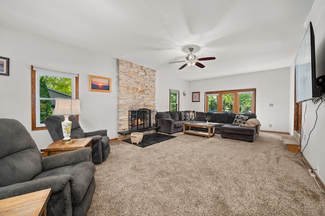 15181 Willow Run Dr, Dekalb, IL 60115 - living area with a ceiling fan, healthy amount of natural light, carpet floors, and a stone fireplace