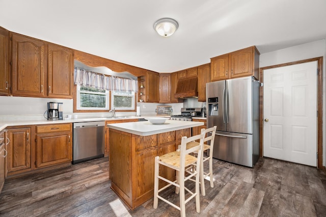 15181 Willow Run Dr, Dekalb, IL 60115 - kitchen with appliances with stainless steel finishes, premium range hood, dark wood-style floors, light countertops, and brown cabinets