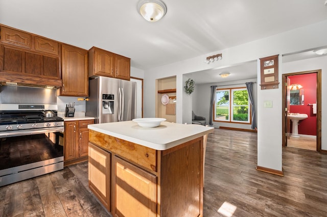 15181 Willow Run Dr, Dekalb, IL 60115 - kitchen featuring stainless steel appliances, light countertops, dark wood-type flooring, and a center island