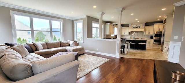 3004 Wayland Ave, Elgin, IL 60124 - living area featuring ornamental molding, plenty of natural light, light wood-style floors, recessed lighting, and ornate columns