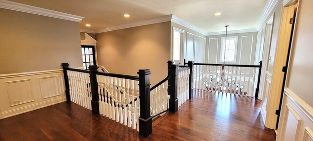3004 Wayland Ave, Elgin, IL 60124 - hallway with an upstairs landing, dark wood-style flooring, recessed lighting, a decorative wall, and ornamental molding