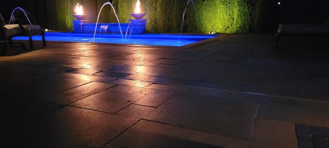 3004 Wayland Ave, Elgin, IL 60124 - pool at night featuring a patio area