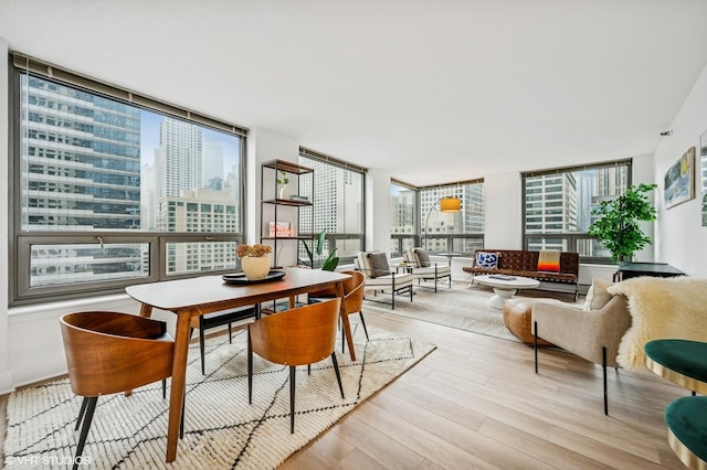 440 N Wabash Ave Unit 1908, Chicago, IL 60611 - dining space featuring wood finished floors and a city view