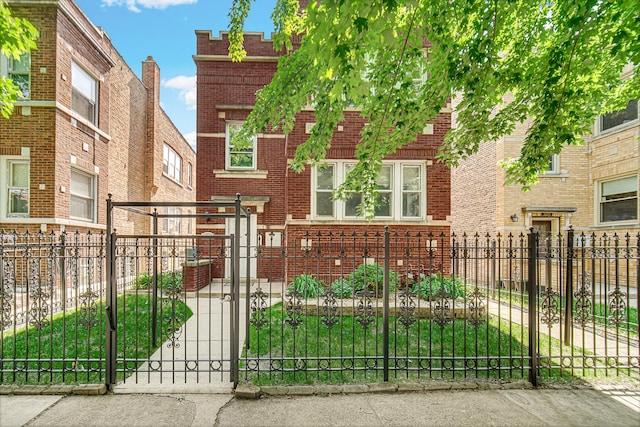 4825 N Karlov Ave, Chicago, IL 60630 - view of front of property featuring brick siding, a fenced front yard, and a gate