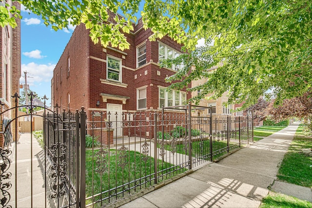 4825 N Karlov Ave, Chicago, IL 60630 - view of front of property with brick siding, a gate, and a fenced front yard