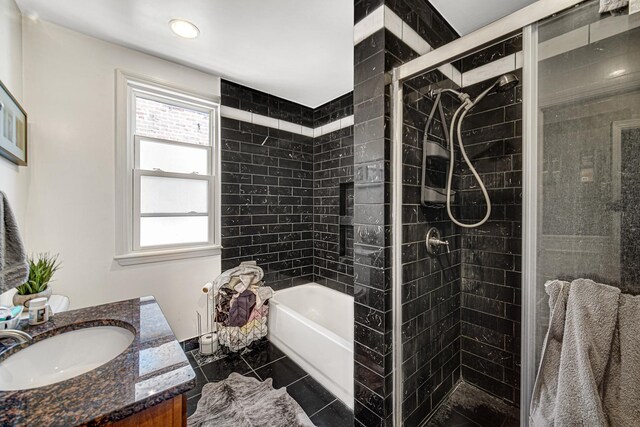 4825 N Karlov Ave, Chicago, IL 60630 - bathroom with a stall shower, vanity, a tub, healthy amount of natural light, and recessed lighting