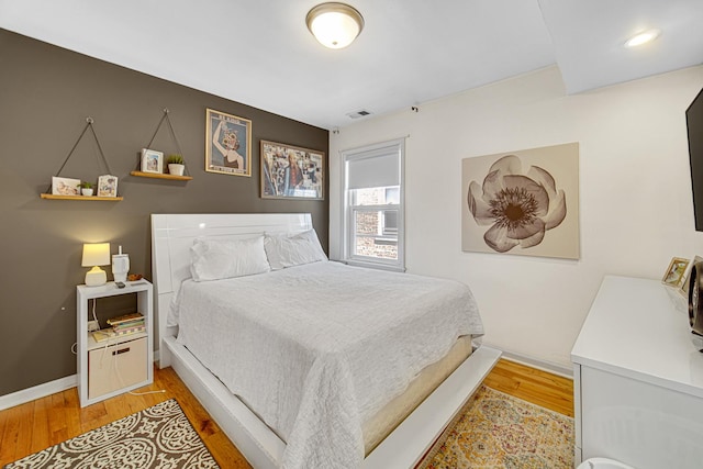 4825 N Karlov Ave, Chicago, IL 60630 - bedroom with light wood-type flooring and baseboards