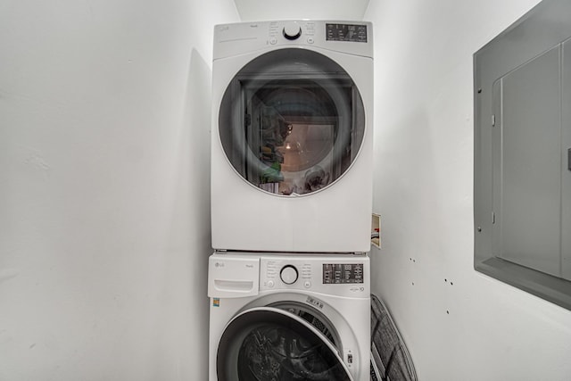 4825 N Karlov Ave, Chicago, IL 60630 - laundry room featuring stacked washer / dryer and electric panel