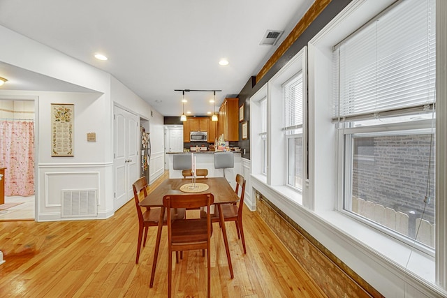 4825 N Karlov Ave, Chicago, IL 60630 - dining space featuring light wood-style flooring, recessed lighting, and wainscoting