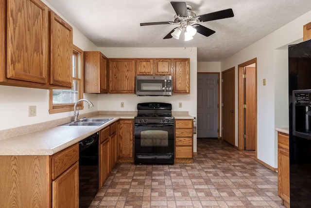 5971 Whispering Way, Loves Park, IL 61111 - kitchen with black appliances, brown cabinetry, light countertops, ceiling fan, and brick patterned flooring