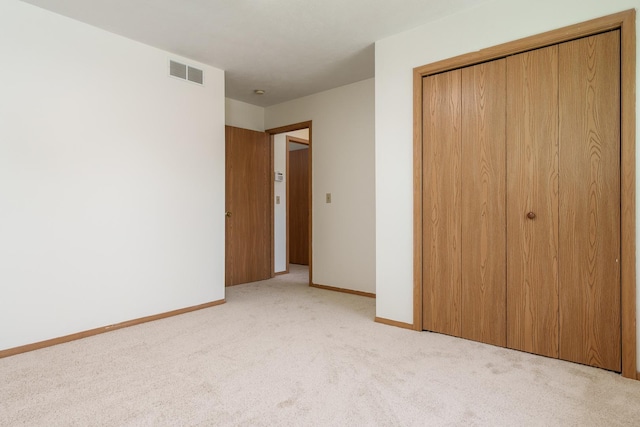 5971 Whispering Way, Loves Park, IL 61111 - unfurnished bedroom featuring light carpet and a closet
