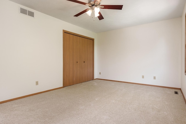 5971 Whispering Way, Loves Park, IL 61111 - unfurnished bedroom featuring light colored carpet, a closet, and ceiling fan