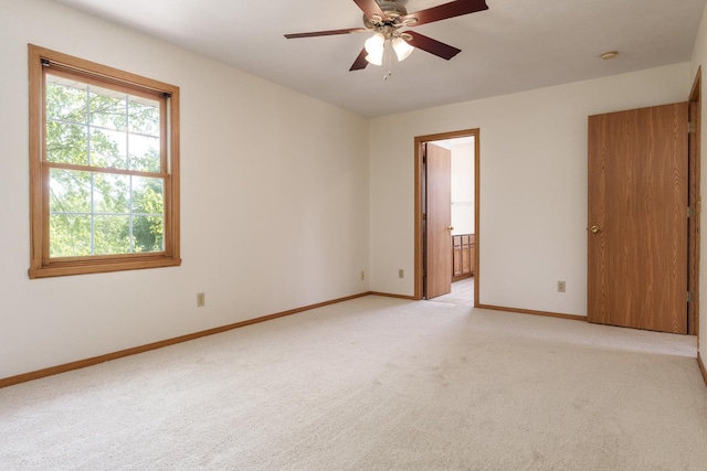 5971 Whispering Way, Loves Park, IL 61111 - spare room with light carpet, ceiling fan, and a smoke detector