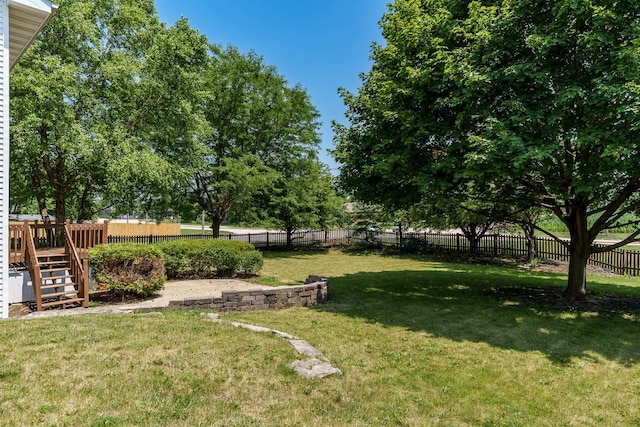 5971 Whispering Way, Loves Park, IL 61111 - fenced backyard with stairway and a wooden deck