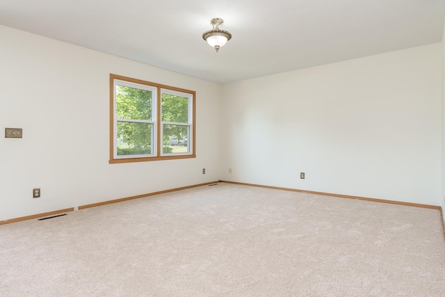 5971 Whispering Way, Loves Park, IL 61111 - spare room featuring baseboards and light colored carpet