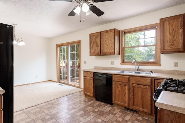 5971 Whispering Way, Loves Park, IL 61111 - kitchen featuring black appliances, brown cabinets, a ceiling fan, and light countertops