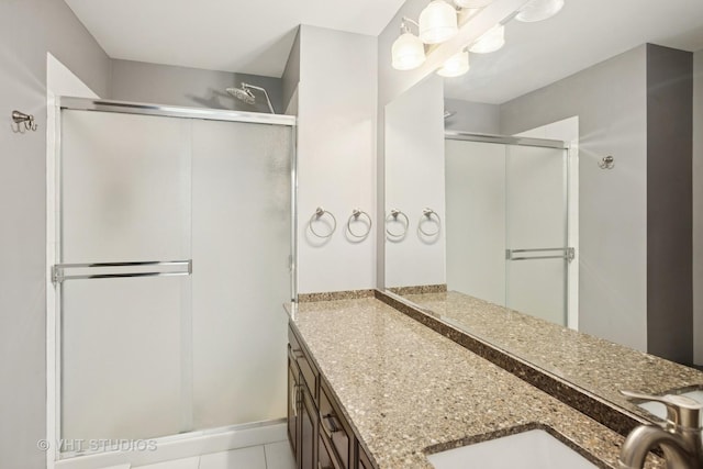 30W020 Mayfair Ct Unit 20, Warrenville, IL 60555 - full bathroom featuring double vanity, a stall shower, and tile patterned floors