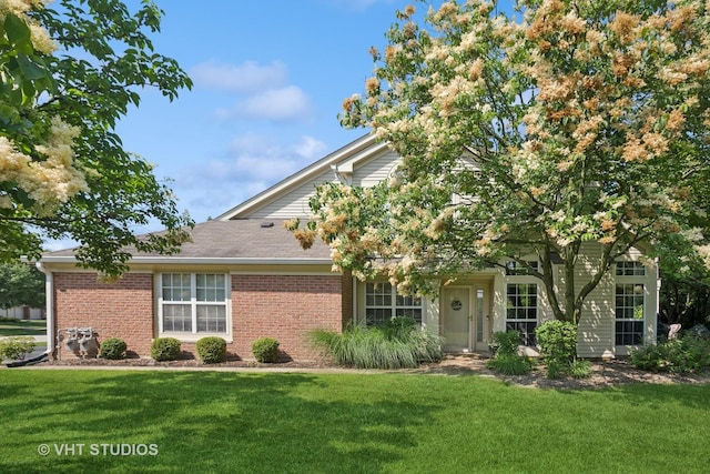 30W020 Mayfair Ct Unit 20, Warrenville, IL 60555 - view of front facade with a front lawn, brick siding, and a shingled roof