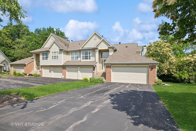 30W020 Mayfair Ct Unit 20, Warrenville, IL 60555 - view of front of house with brick siding, driveway, a garage, and a front lawn