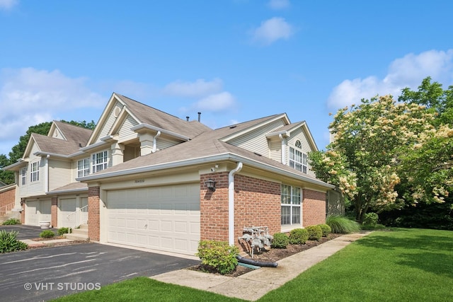30W020 Mayfair Ct Unit 20, Warrenville, IL 60555 - view of side of property with brick siding, driveway, an attached garage, a yard, and roof with shingles